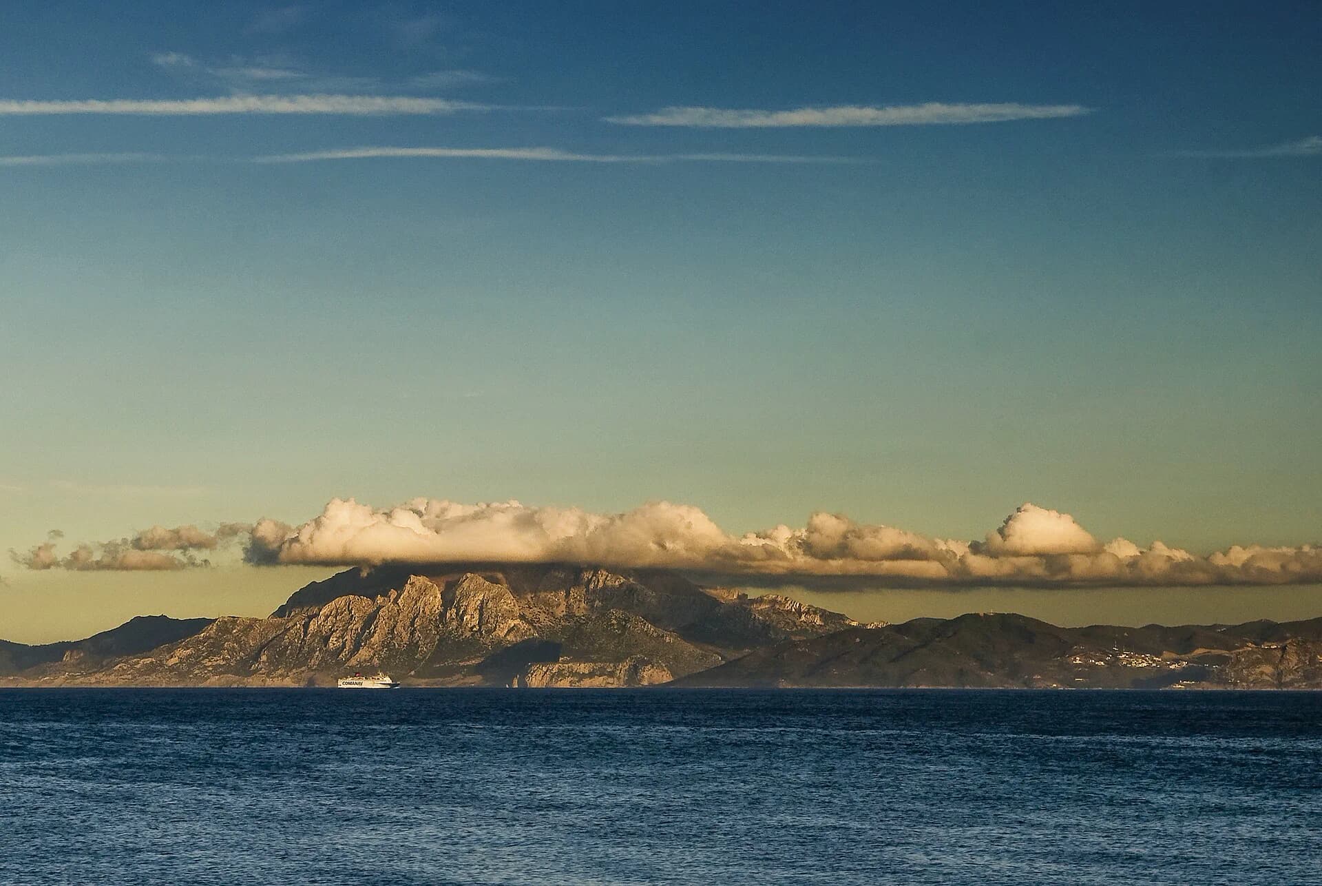 The Rif mountains of Morocco across the Strait, with a ferry crossing